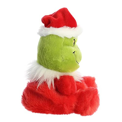 A green plush Grinch wearing a Santa hat. The Grinch has a big smile and a grumpy expression. 