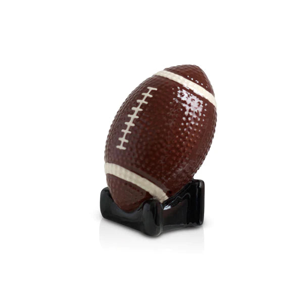 American football on a white pedestal