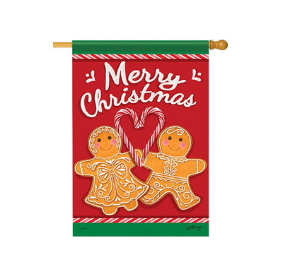 Gingerbread man and woman holding candy canes. Rosy cheeks, black button eyes, white icing smiles