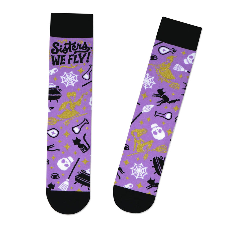 Pair of purple and black socks with text "Sisters WE FLY!