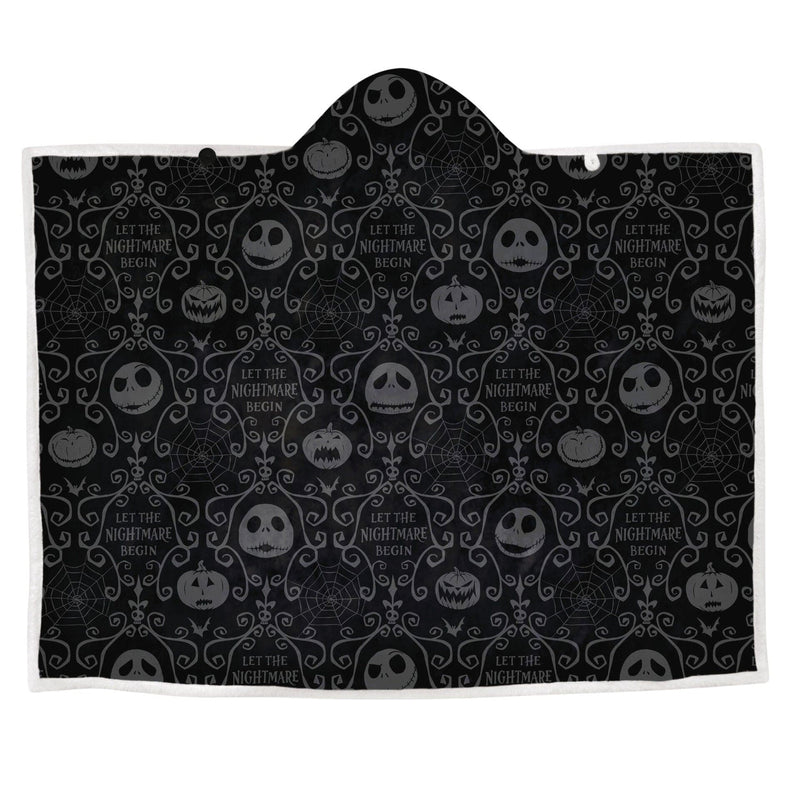 Black and white Nightmare Before Christmas hooded blanket with Jack Skellington’s face on the hood. Text in Arabic says "Allah